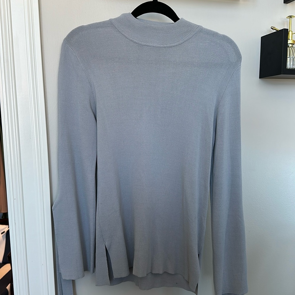 Grey mock-neck sweater with bell sleeves